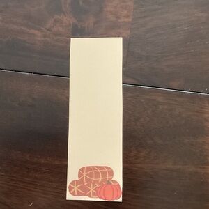 Cream stationary bookmark with brown accents